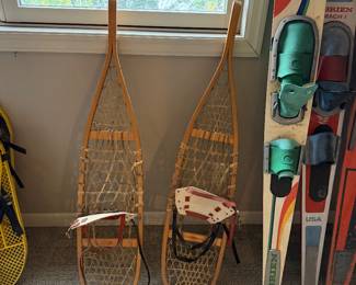 vintage wooden snowshoes feature traditional rawhide lacing and leather bindings