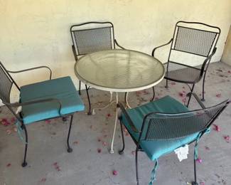 Mismatched Table And Four Chairs For Your Patio