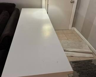 A Table And A Floor Lamp