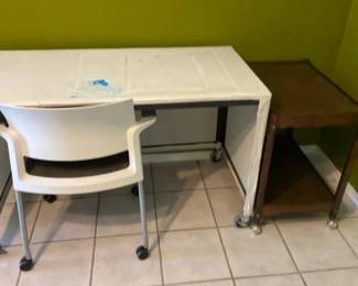 A Metal ArtCraft Table On Wheels And A Smaller Side Table