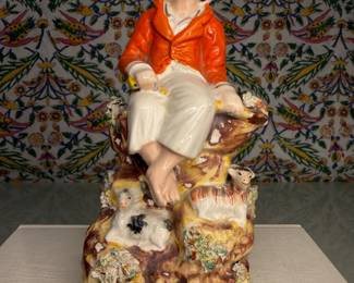 Staffordshire Pottery Figure of a Seated Youth with Sheep