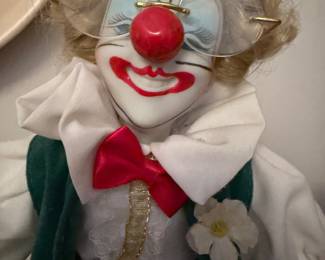 Porcelain clown, with glasses.