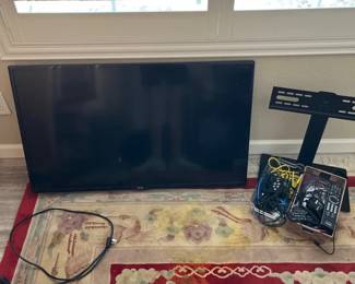 LG TV, Stand, And Various Cords