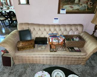Vintage upholstered sofa, lots of playing cards / bridge sets, vintage scrapbook, decorative boxes