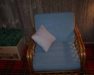 ONE OF THE RATTAN EASY CHAIRS