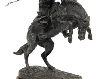 Lot 1130 After Frederic Remington (American, 1861-1909) Bronze Sculpture "Bronco Buster" 1960, H 17.5" L 16" 1 PC