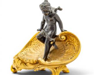Lot 1136 After Claude Michel Clodion (French, 1738-1814) D'ore Bronze Tazza 1880-1900, 'Cherub Dipping Her Toes in the Water of a Shell', H 4.75" W 5.75"