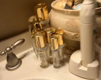 Perfume bottles and electric toothbrush