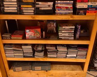 Shelf of DVDs, CDs, and VHS tapes
