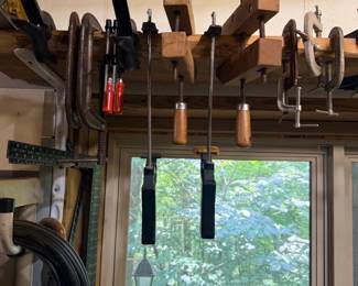 Wood clamps and chisels above window