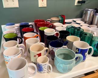 Large collection of coffee mugs and cups