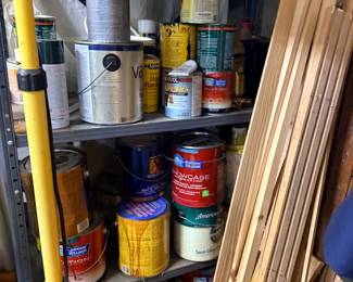 Paint cans, stains, and trim lumber