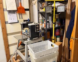 Paint supplies, shelf, and garage storage