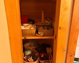 Closet shelves with baskets and craft supplies