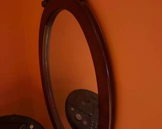 Oval wood frame wall mirror