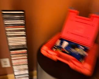 CD tower rack with CDs and tool case