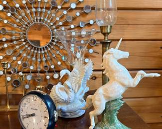 Porcelain unicorn figurines and starburst mirror
