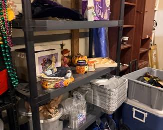 Storage shelf with cookware, cooler, and decor
