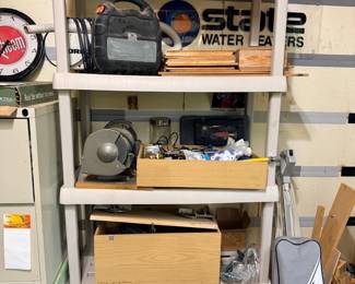 Garage shelf with tools and Oreck vacuum
