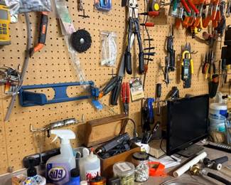 Pegboard of hand tools, pliers, and clamps