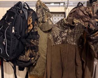 Camo hunting jacket, waders, and backpacks