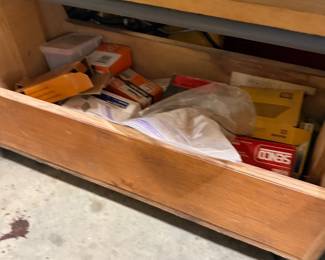Wood drawer of shop hardware and supplies