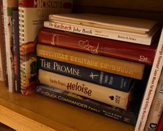Shelf of cookbooks and humor books