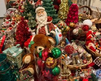 Christmas Santas, teddy bear, and ornaments display