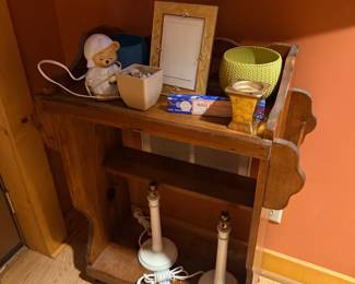 Wood wall shelf with candlestick lamps and decor