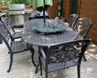 Cast aluminum patio table with 6 chairs and umbrella