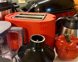 Red toaster, blender, and countertop appliances