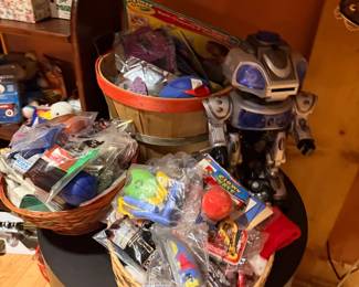 Basket of toys and robot figure