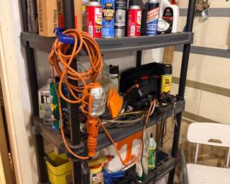 Garage shelf with cords and car care supplies
