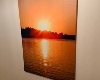 Sunset over water canvas print