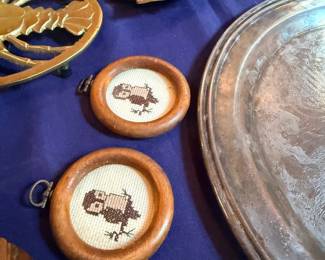 Brass trivets, cross stitch owls, silver tray