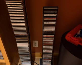 Two CD storage towers full of music CDs