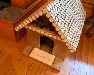 Handcrafted wood birdhouse with shingle roof