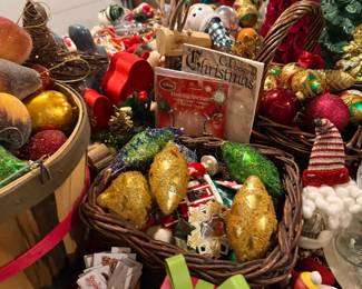 Baskets of Christmas ornaments and holiday decor