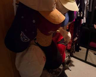 Collection of baseball caps and hats