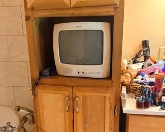 Vintage RCA small TV in bathroom cabinet