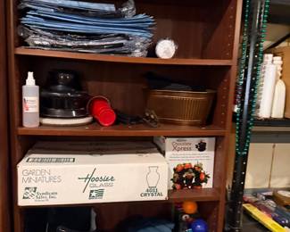 Shelf of holiday decor and garden miniatures