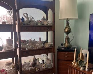 Lots of beautiful tchotchkes. LPs and a tambourine LP storage furniture. Hollywood Regency lamp in a stunning condition.