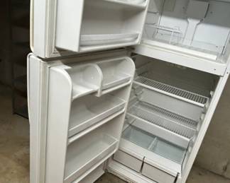 White Refrigerator with Freezer - This is a white refrigerator with a freezer compartment, featuring multiple shelves and drawers. Ideal for kitchen storage.