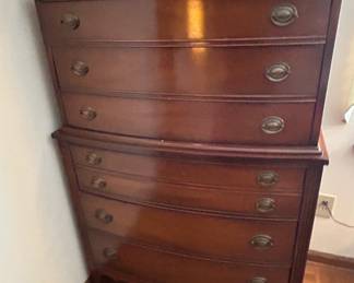 Vintage Wooden Chest of Drawers - A classic wooden chest of drawers featuring a rich finish and elegant hardware. Perfect for adding storage and style to any room.