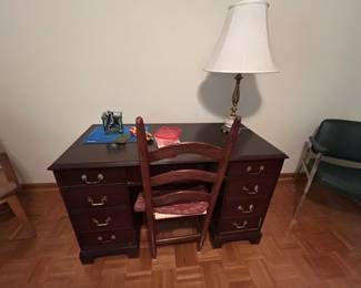 Wooden Writing Desk with Chair - A classic wooden writing desk featuring multiple drawers and a matching chair. Ideal for home office or study use.