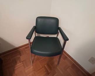 Mid-Century Modern Green Chair - Stylish mid-century modern chair with a green vinyl seat and chrome legs. Perfect for home or office use.