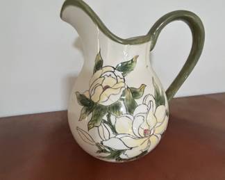Vintage Floral Pitcher with Green Handle - Charming vintage pitcher featuring a floral design with a green handle. Perfect for display or use.