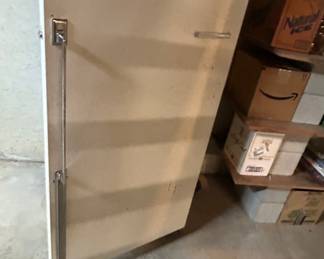 Vintage Cream Colored Refrigerator - A vintage cream colored refrigerator with a sleek design, perfect for retro-themed kitchens or as a unique storage solution.