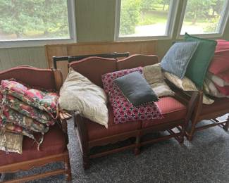 Vintage Upholstered Loveseat with Cushions - A charming vintage loveseat featuring a rich upholstery and several decorative cushions. Perfect for adding a cozy touch to any living space.