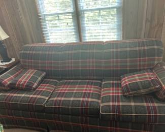 Vintage Plaid Sofa with Cushions - A cozy vintage sofa featuring a plaid pattern with matching cushions, perfect for adding a rustic touch to your living space.